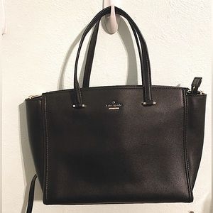 Black Kate Space crossbody, medium sized with gold details.